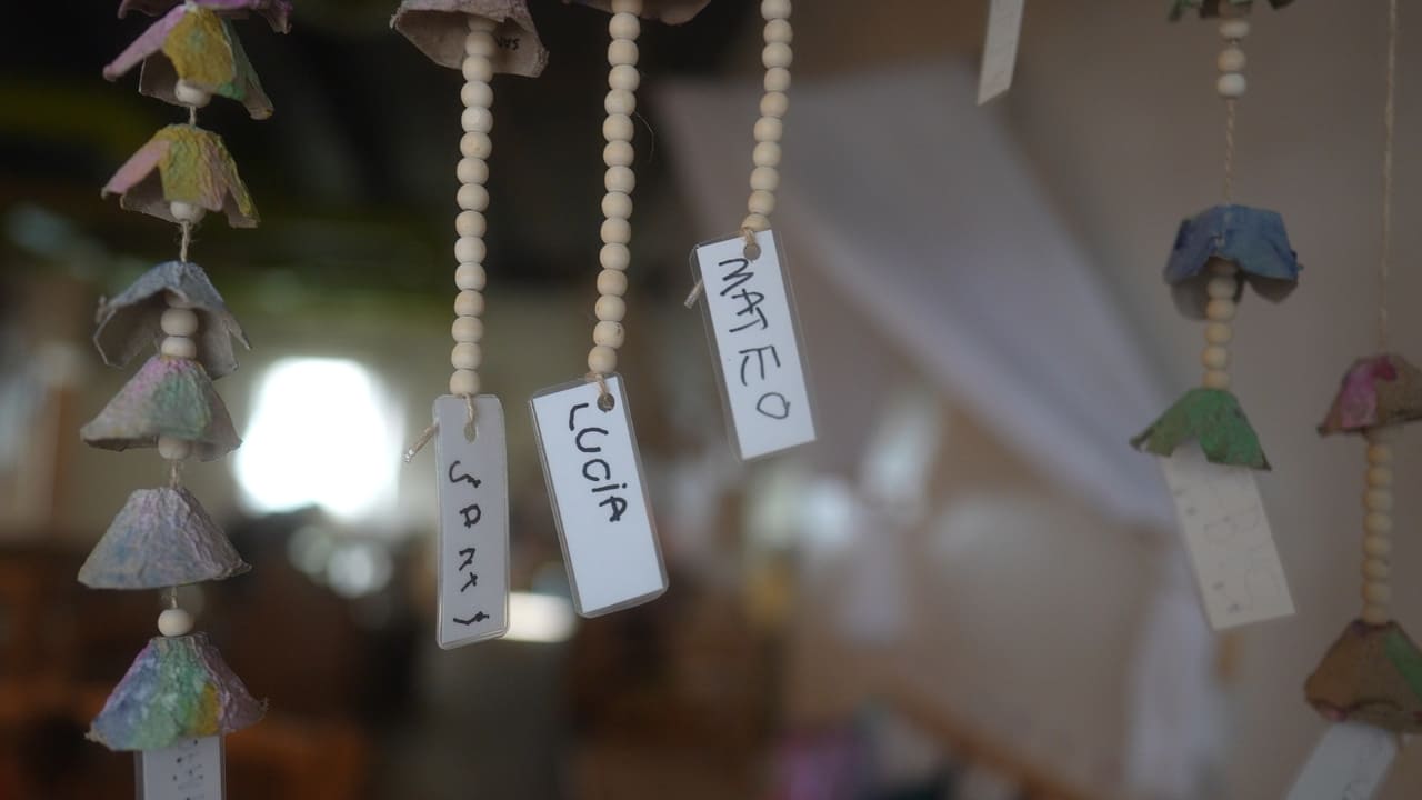 Handmade classroom decorations created by children at Here & There Preschool
