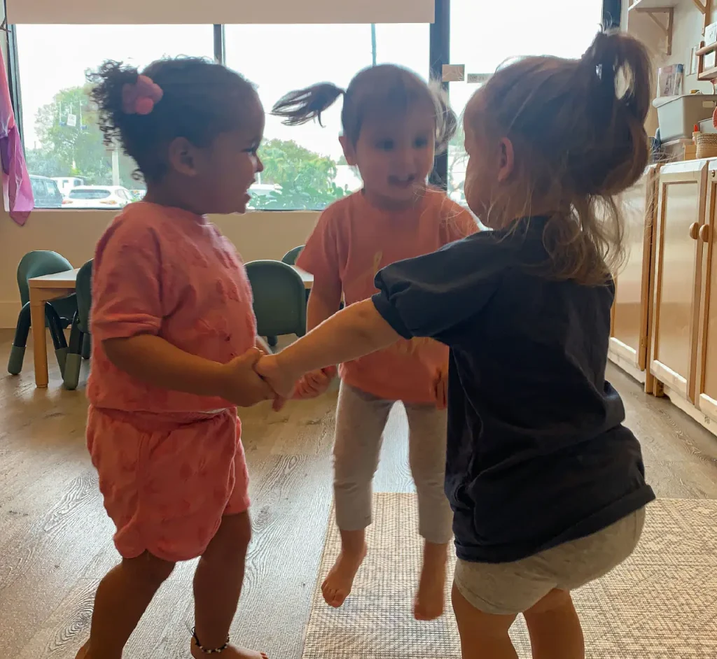 Preschool children building friendships through cooperative play at Here & There Preschool
